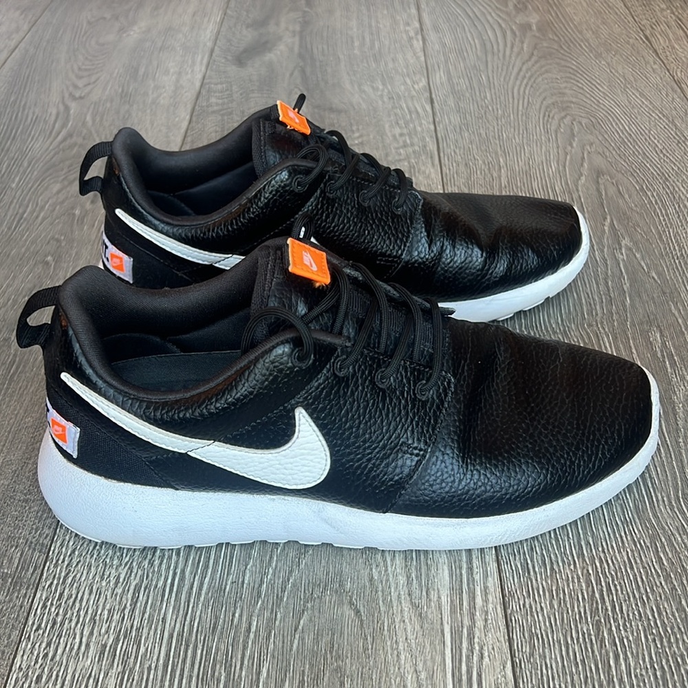 Nike Women's Black and White Sneakers with Orange Accents